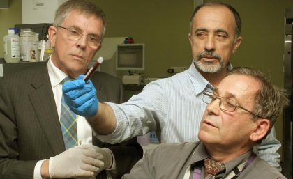 Queensland Minister Ian Walker, left, Dr Goce Dimeski and Dr Paul Masci.